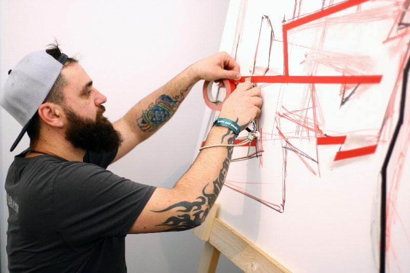 Artist Slava Ostap at work- Making of tape art