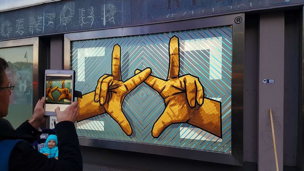The Hands-the haus- brown packing tape street art by Selfmadecrew