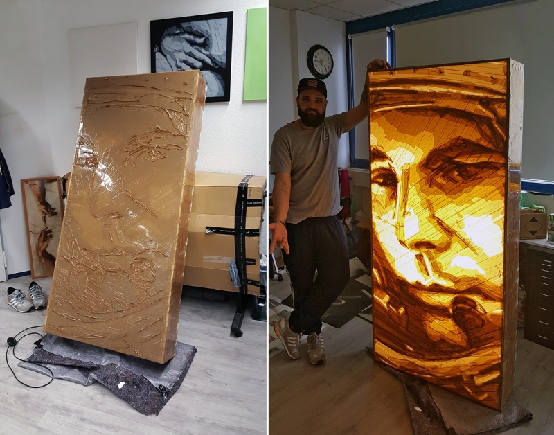 Tape-Art-Künstler Ostap im Atelier mit Packband-Portrait von Yuri Gagarin