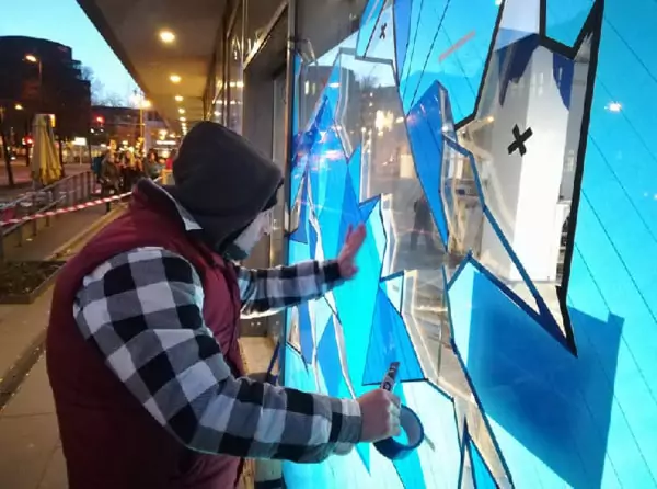 Selfmadecrew at work- Packing Tape Portrait- Street Art Berlin