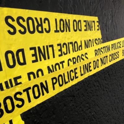 Boston police do not cross the line- the tape (closeup)