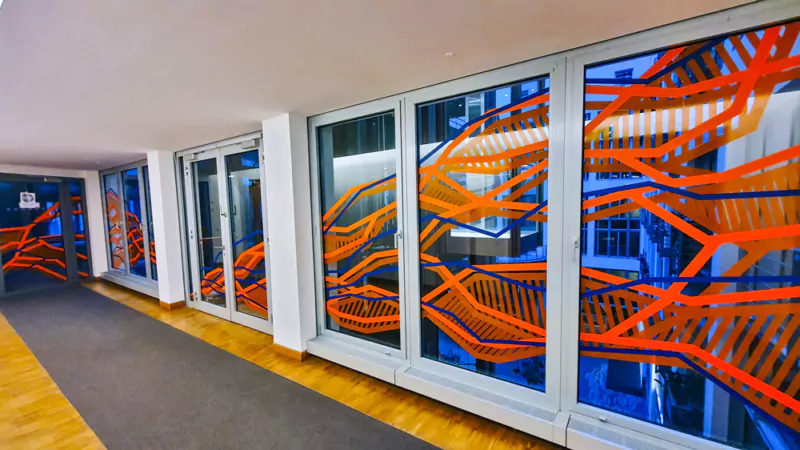 Abstract tape art pattern on windows. By Selfmadecrew