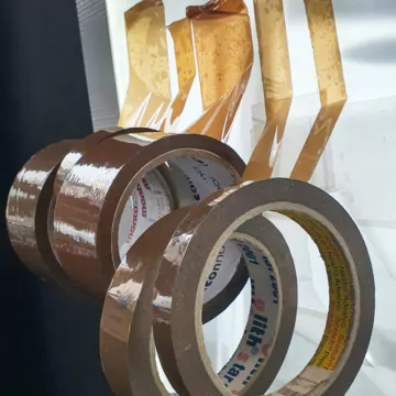Brown packing tape rolls that we use as paint